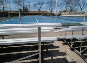 Empty bench in swimming pool