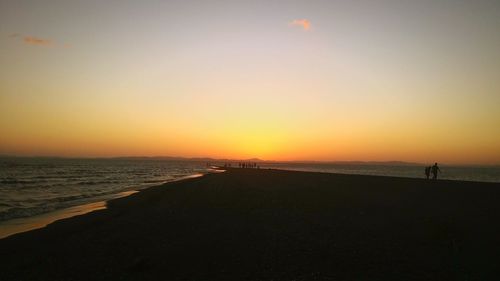 Scenic view of sea against clear sky during sunset