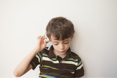 Boy against white background