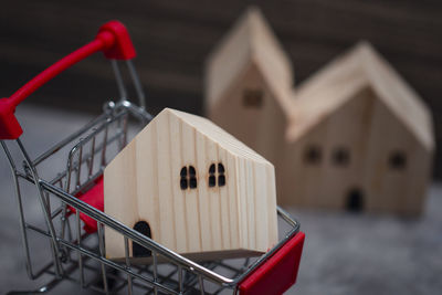 Close-up of red toy against building