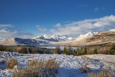 Scenic view of snowcapped mountains against sky