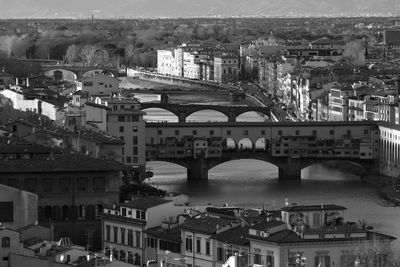 High angle view of bridge over river and buildings in city