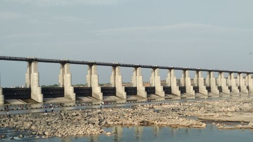 Bridge over sea against sky