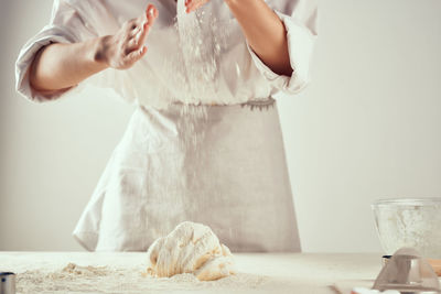 Midsection of woman preparing food