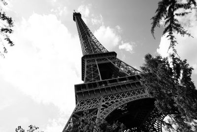 Low angle view of tower against cloudy sky