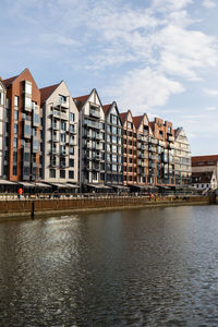 Modern buildings on granary island over the motlawa river in old town. abstract structure. creative