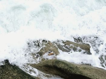 Scenic view of sea waves splashing on rocks