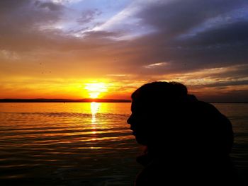 Scenic view of sea at sunset
