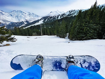 Scenic view of snow covered mountains against sky