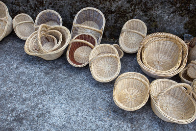 High angle view of wicker baskets on footpath