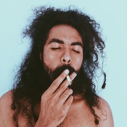 Portrait of man smoking cigarette