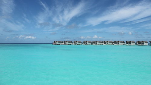 Scenic view of sea against blue sky