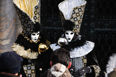 Close-up of men wearing mask