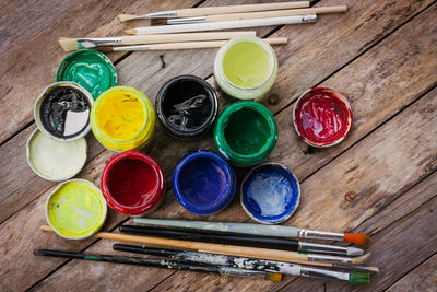 High angle view of various paint on table