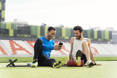 Friends sitting on mobile phone