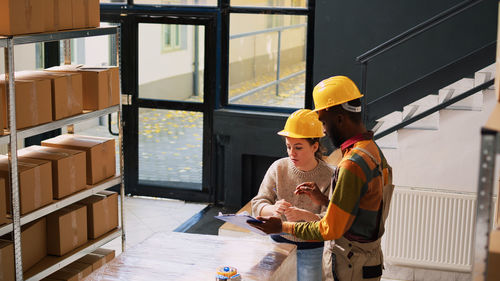 Rear view of man working at construction site