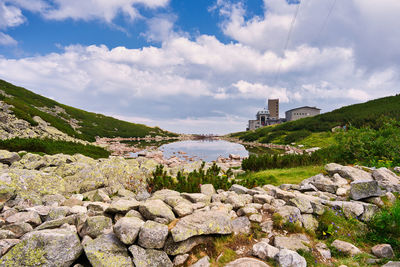 Panoramic view of buildings and rocks against sky