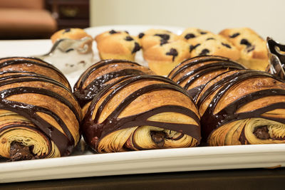 Flakey chocolate croissant grouped on a plate in a bakery fresh from the oven
