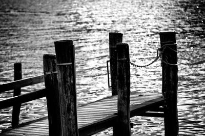 Close-up of wooden post on pier at sea