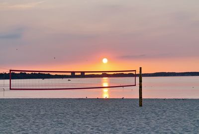 Scenic view of sea against orange sky