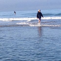 Full length of young man standing at beach