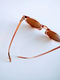 Close-up of sunglasses against white background