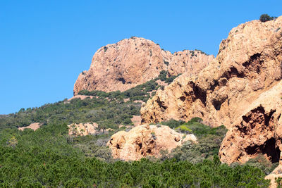 Scenic view of rocky mountains against clear blue sky
