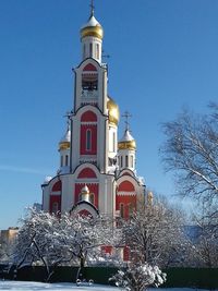 Low angle view of church against sky during winter