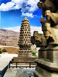 Statue of temple against building