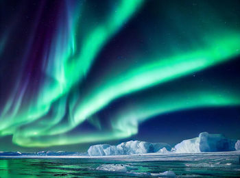 Scenic view of sea against sky at night