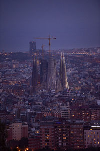 Aerial view of buildings in city at night