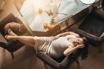 Low section of woman sitting on floor
