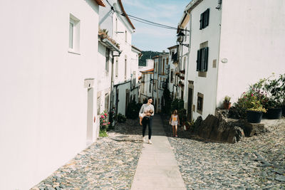 Rear view of man walking on street