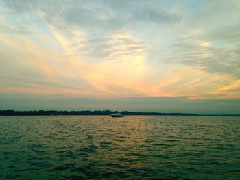 Scenic view of sea against cloudy sky