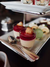 Close-up of desserts served on table