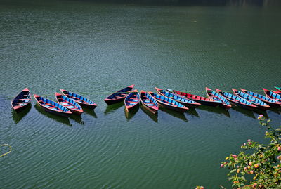Brightly painted boats on phewa lake at pokhara, nepal