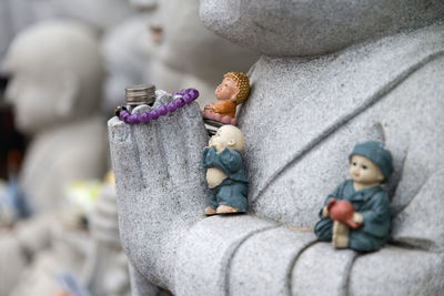 Close-up of boy statue on rock