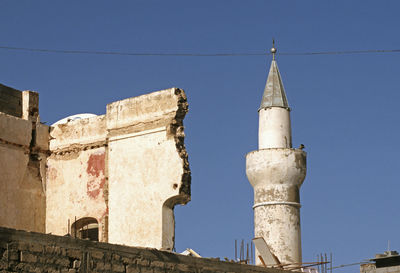 Low angle view of old building against sky