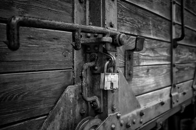 Close-up of padlock on metal door