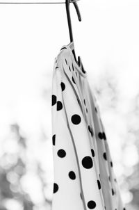 Low angle view of dress hanging against sky