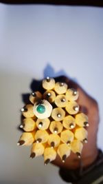 Close-up of colored object over white background