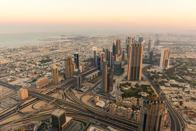 High angle view of city buildings during sunset