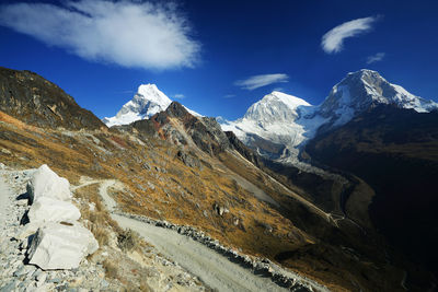 View of mountain peaks with snow against sky