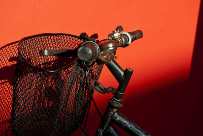Close-up of bicycle by wall