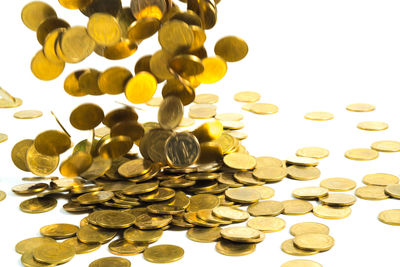 Close-up of coins on white background