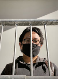 Portrait of young man sitting in container