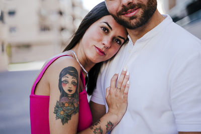 Portrait of couple kissing outdoors