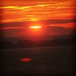 Scenic view of dramatic sky during sunset