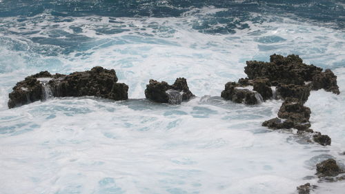 Scenic view of rocks in sea