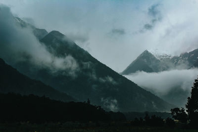 Scenic view of silhouette mountains against sky